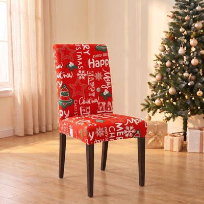 Happy Holidays Christmas stretch chair cover on a dining chair by the Christmas tree
