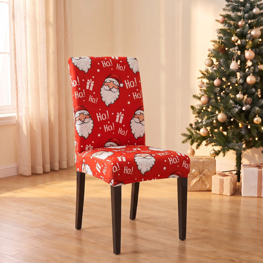 Ho Ho Ho Christmas stretch chair cover on a dining chair by the Christmas tree