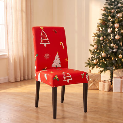 Winter Trees Christmas stretch chair cover on a dining chair by the Christmas tree
