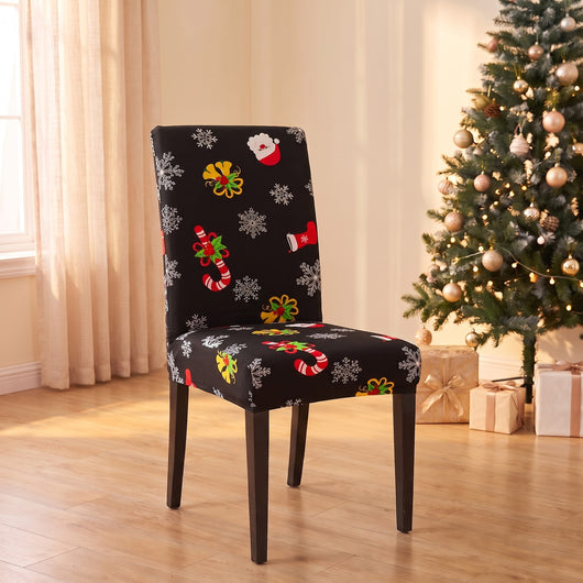 Black Candy Cane Christmas stretch chair cover on a dining chair by the Christmas tree