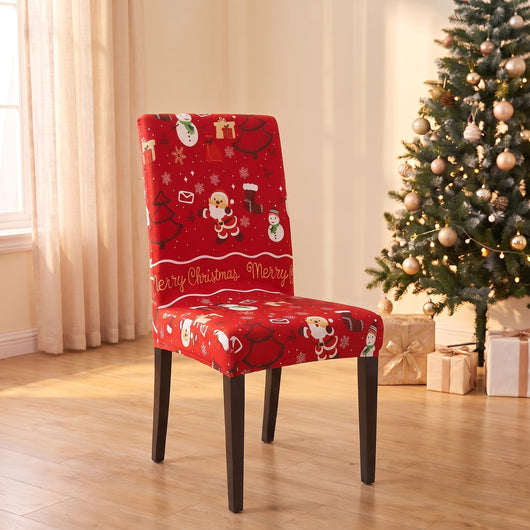 Merry Gingerbread Christmas stretch chair cover on a dining chair by the Christmas tree