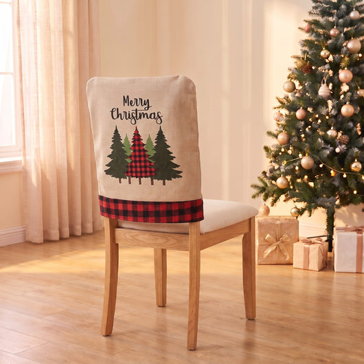 Plaid Pines Christmas chair back cover on a dining chair by the Christmas tree