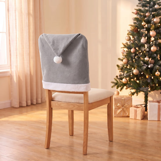 Silver Santa Hat Christmas chair back cover on a dining chair by the Christmas tree